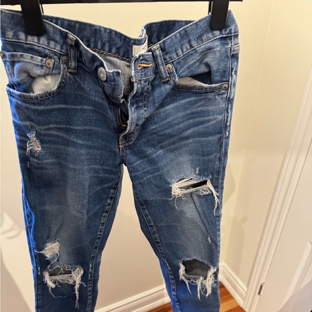 Mousy vintage denim. Great fit. Holes. Taper at bottom slightly boyfriend style